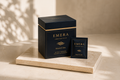 The EMERA Ritual of Calm box and a single-serve sachet on cream marble